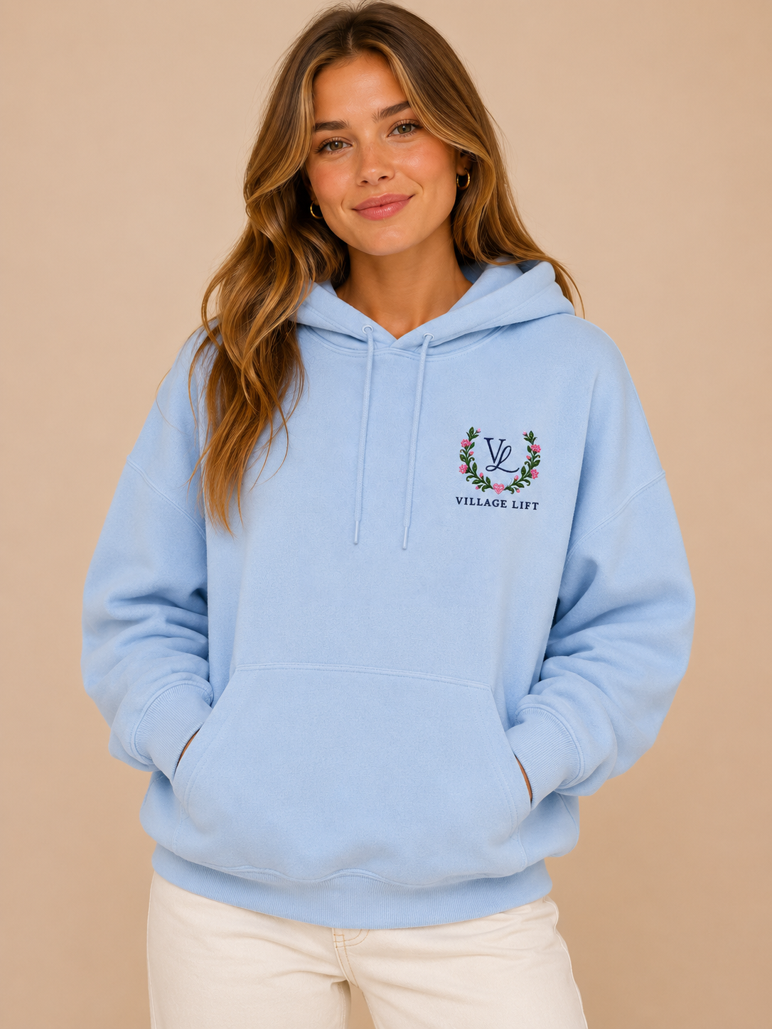 Front view of the blue Signature Collection Sweatshirt from Village Lift with a small chest design.