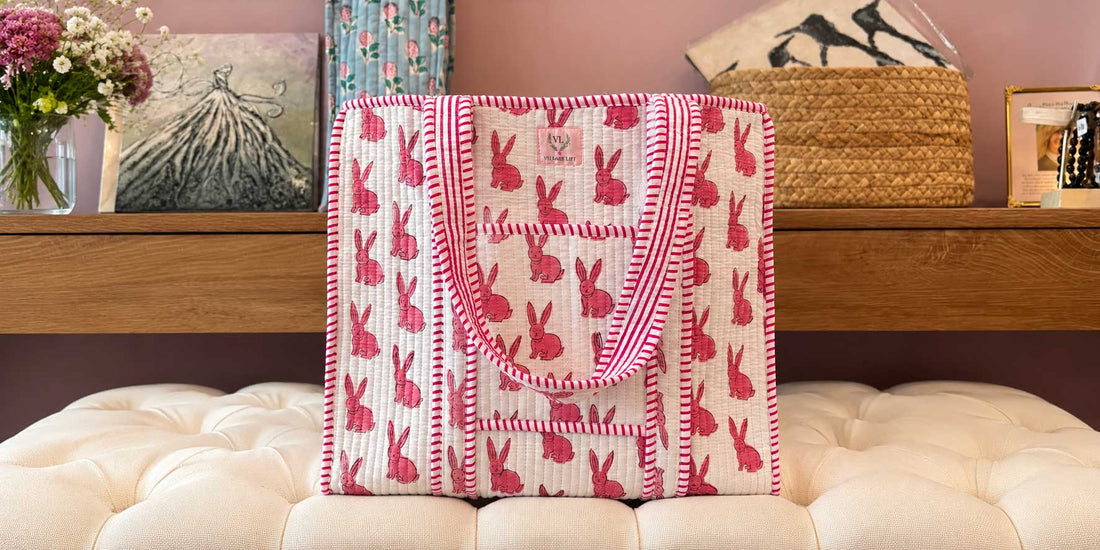 Quilted reversible tote bag featuring pink bunny prints and striped trim by Village Lift.
