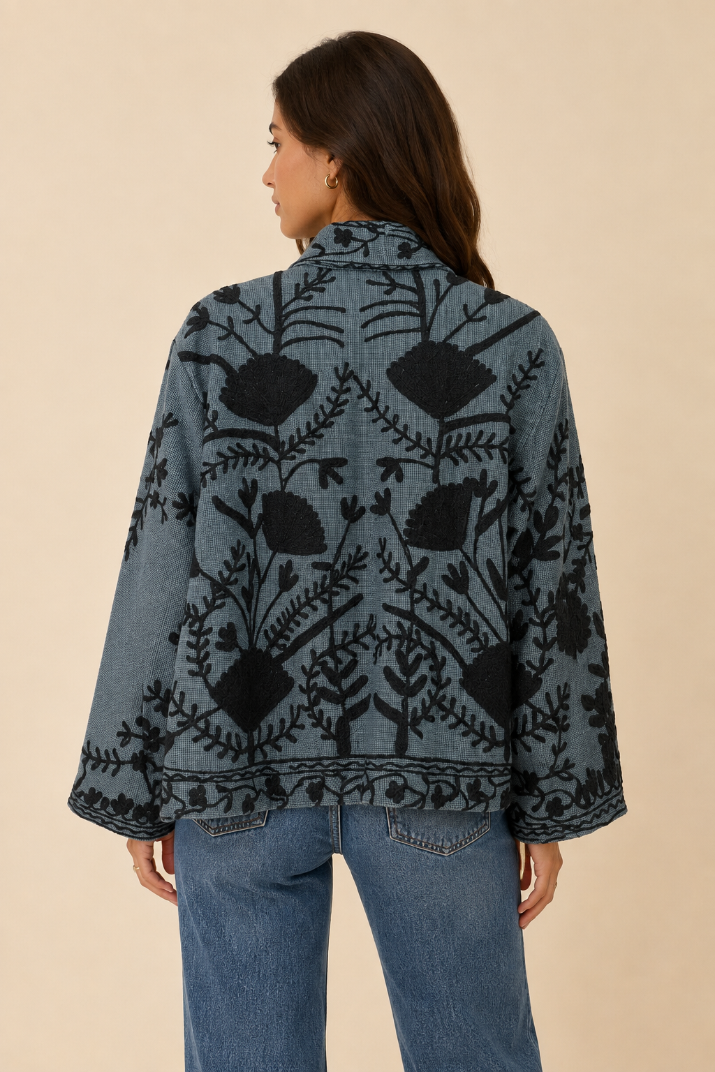Back view of the Emmy embroidered reversible jacket featuring black floral embroidery